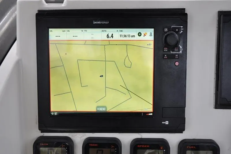 Slide: The Image of Simrad navigation display on 2006 Pursuit 2570 Center Console boat dashboard. - 45