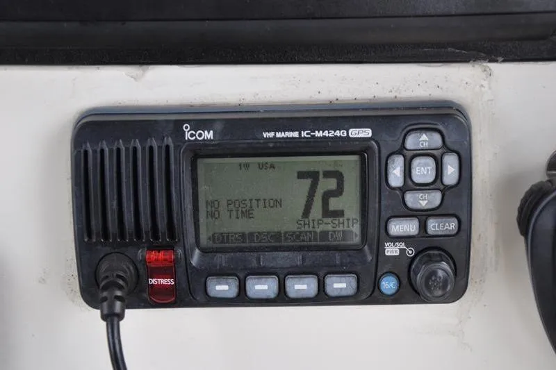 Slide: The Image of VHF marine radio on 2006 Pursuit 2570 Center Console boat dashboard. - 46
