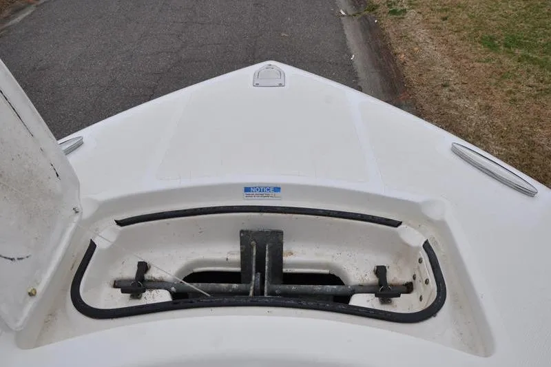 Slide: The Image of Bow storage compartment of a 2006 Pursuit 2570 Center Console boat. - 55
