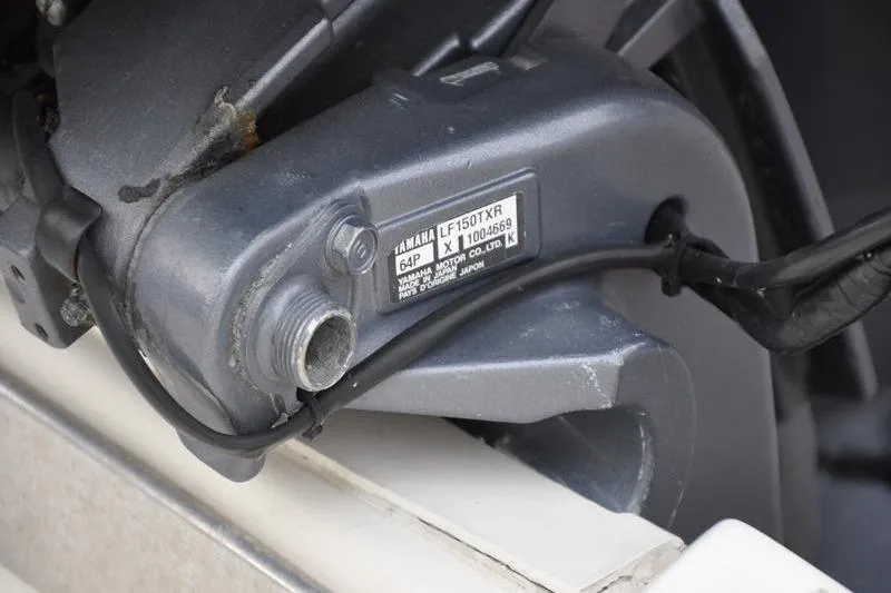 Slide: The Image of Close-up of Yamaha LF150TXR engine part on 2006 Pursuit 2570 Center Console boat. - 56