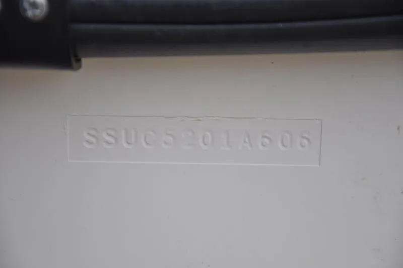 Slide: The Image of 2006 Pursuit 2570 Center Console hull identification number (HIN) close-up. - 58