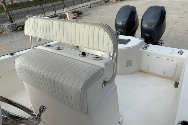Slide: The Image of 2004 Cape Horn 24 boat interior with dual Yamaha 150 engines, white seating. - 13