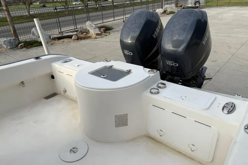 Slide: The Image of 2004 Cape Horn 24 boat with dual Yamaha 150 engines, docked outdoors. - 7
