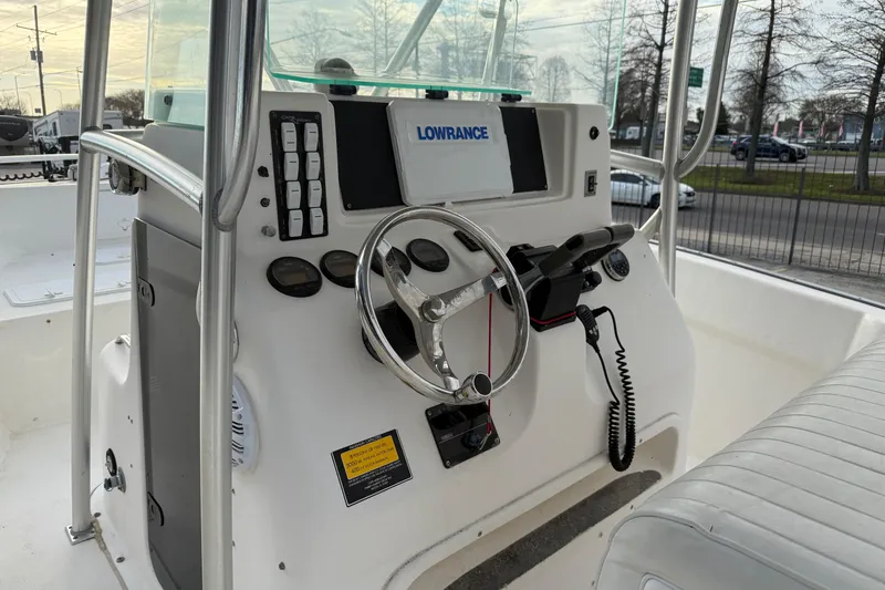 Slide: The Image of 2004 Cape Horn 24 boat console with steering wheel and Lowrance navigation system. - 8