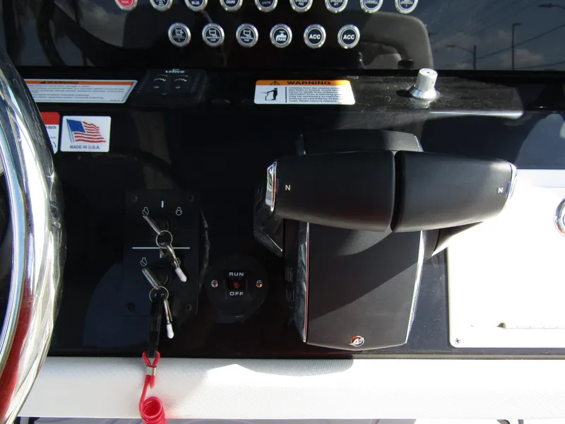 Slide: The Image of Close-up of 2024 Wellcraft 263 Fisherman boat control panel and throttle. - 20
