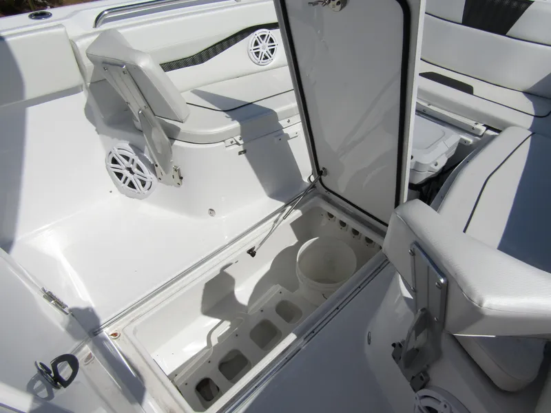 Slide: The Image of 2024 Wellcraft 263 Fisherman boat interior with open storage compartment. - 9