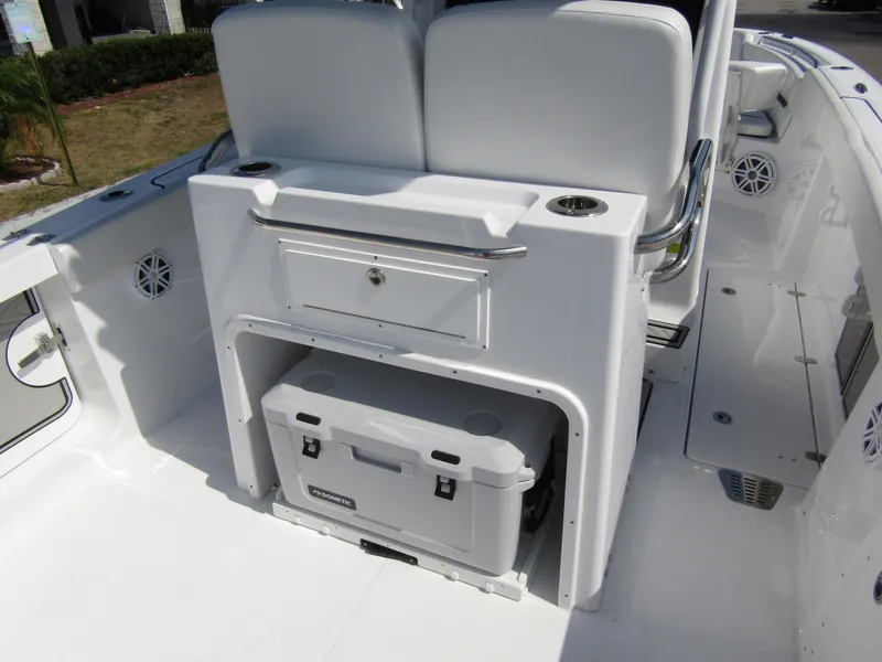 Slide: The Image of 2024 Wellcraft 263 Fisherman boat interior with storage and cooler. - 32