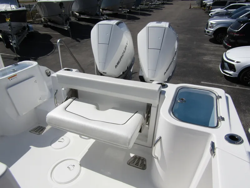 Slide: The Image of 2024 Wellcraft 263 Fisherman boat with dual Mercury engines and foldable seating. - 28