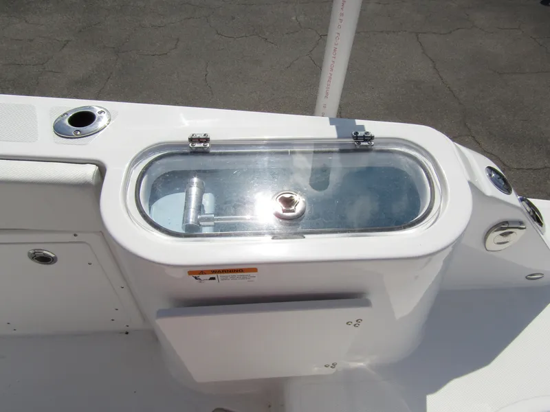 Slide: The Image of 2024 Wellcraft 263 Fisherman livewell with clear lid and rod holders. - 30