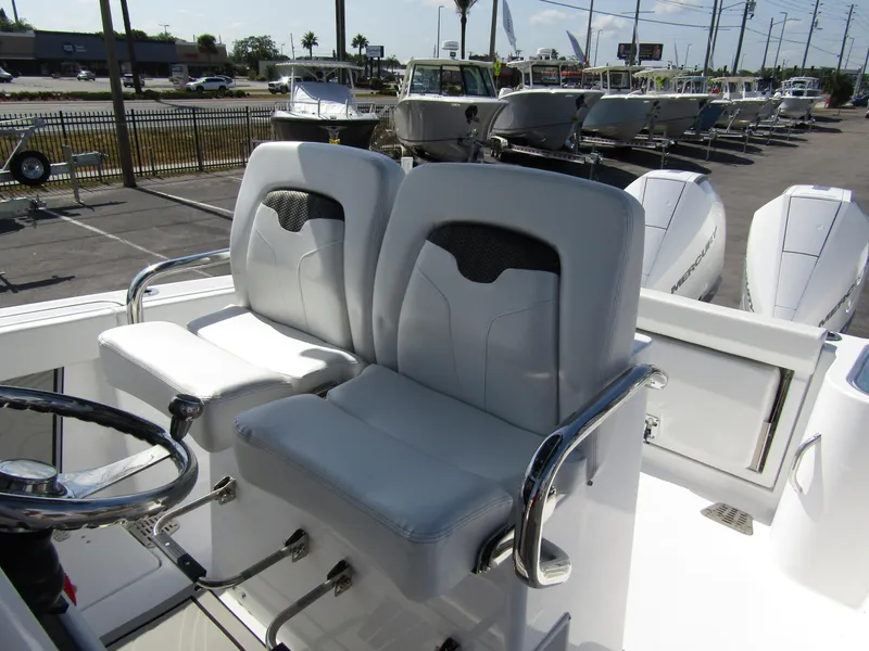 Slide: The Image of 2024 Wellcraft 263 Fisherman boat seats and steering wheel. - 14