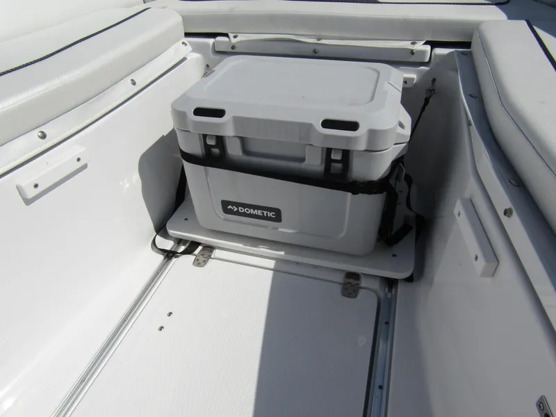 Slide: The Image of 2024 Wellcraft 263 Fisherman boat interior with Dometic cooler. - 7