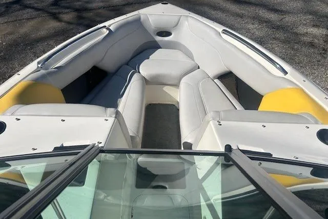 Slide: The Image of 2004 Centurion Lightning boat interior with white and yellow seating. - 9