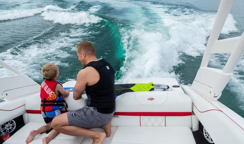 Slide: The Image of Father and son on Regal LS2 Surf Ultimate 2026 boat. - 36
