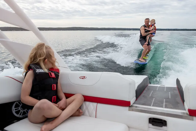 Slide: The Image of Child on Regal LS2 Surf Ultimate 2026 boat, pulling surfer. - 38