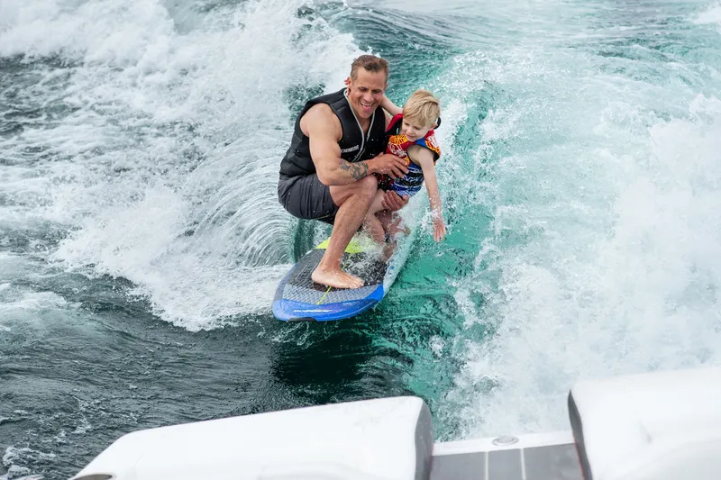 Slide: The Image of Family enjoying watersports on Regal LS2 Surf Ultimate 2026. - 40