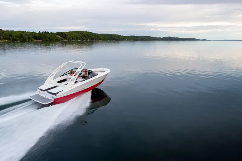 Slide: The Image of 2026 Regal LS2 Surf Ultimate boat on calm water. - 7