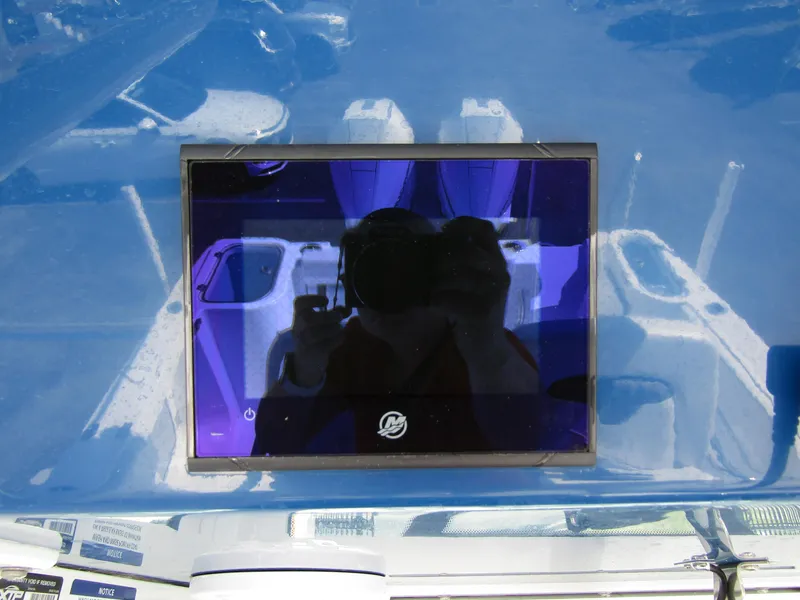 Slide: The Image of 2024 Wellcraft 263 Fisherman boat dashboard with reflective display screen. - 23