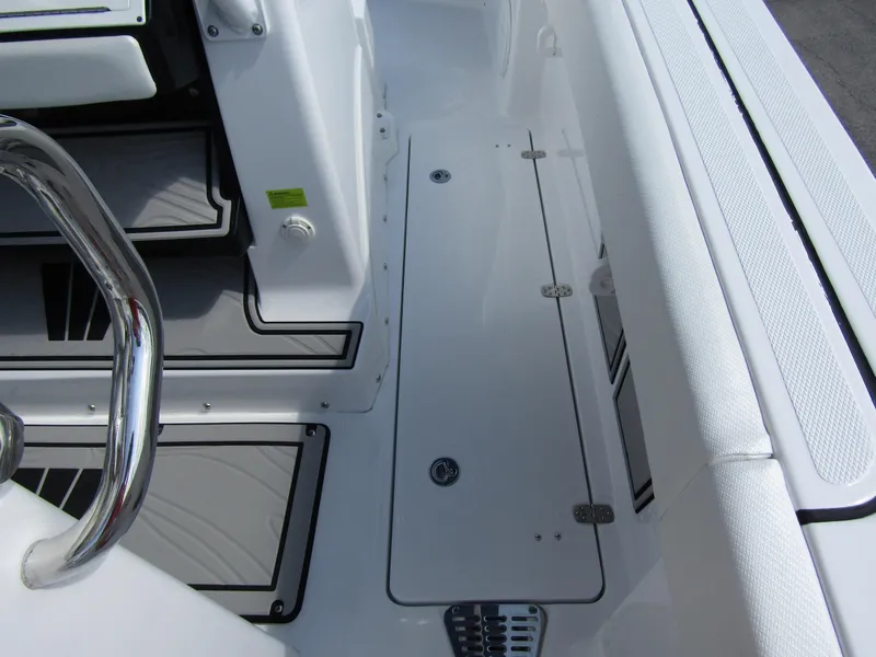 Slide: The Image of 2024 Wellcraft 263 Fisherman boat deck with storage compartments and seating. - 34