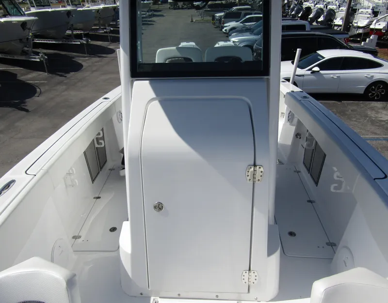Slide: The Image of 2024 Wellcraft 263 Fisherman boat interior, featuring a center console and spacious deck. - 10