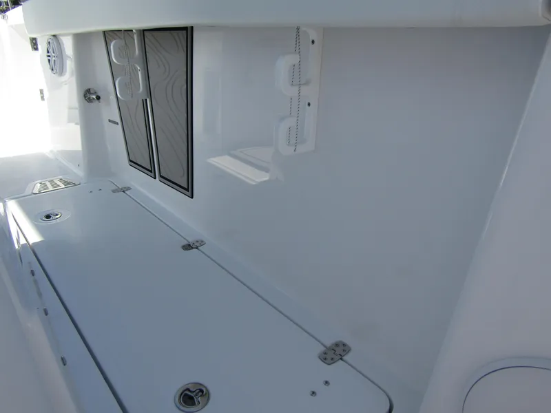 Slide: The Image of 2024 Wellcraft 263 Fisherman boat interior storage compartments and speaker system. - 12