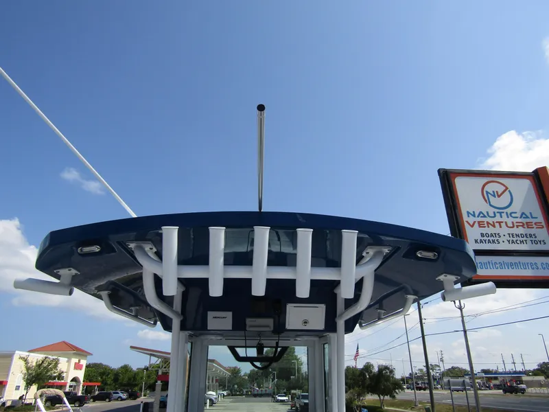 Slide: The Image of 2024 Wellcraft 263 Fisherman boat with T-top and rod holders. - 33