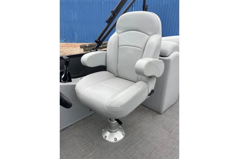 Slide: The Image of Luxurious captain's chair on 2023 Bentley Pontoons 243 Navigator boat, featuring plush gray upholstery. - 19