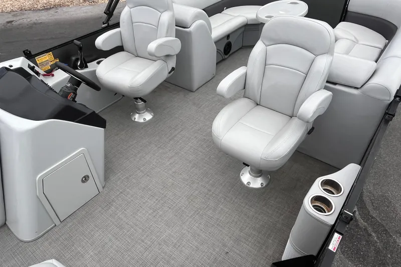 Slide: The Image of 2023 Bentley Pontoons 243 Navigator interior with plush seating and modern helm. - 22