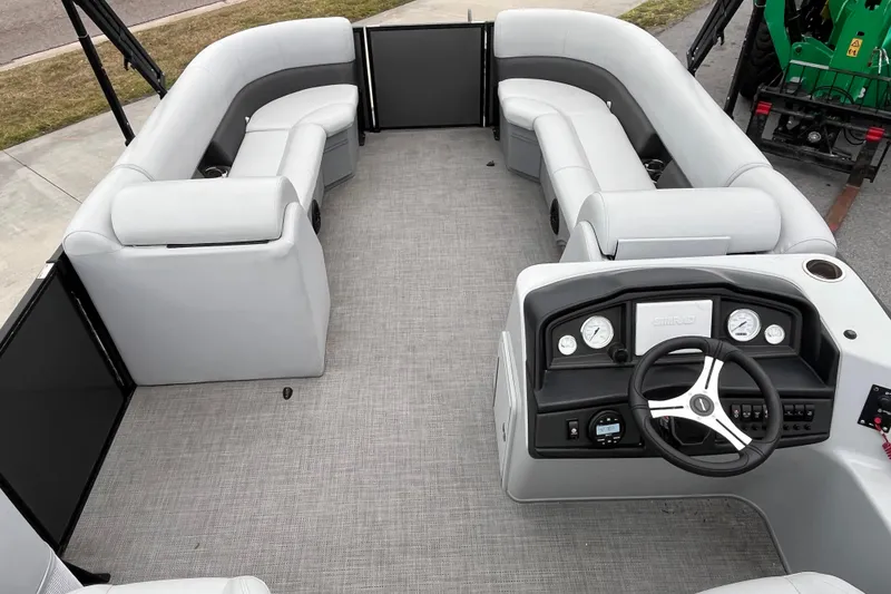 Slide: The Image of 2023 Bentley Pontoons 243 Navigator interior with spacious seating and modern dashboard. - 25