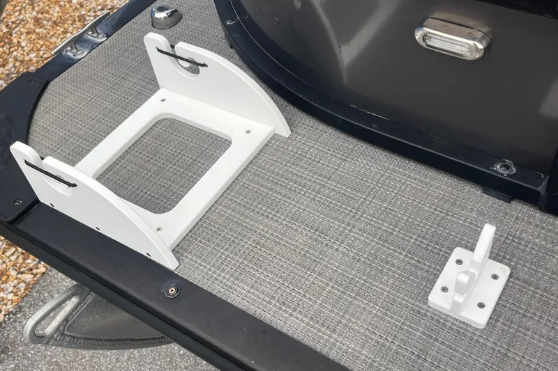 Slide: The Image of 2023 Bentley Pontoons 243 Navigator deck with white mounting brackets. - 29