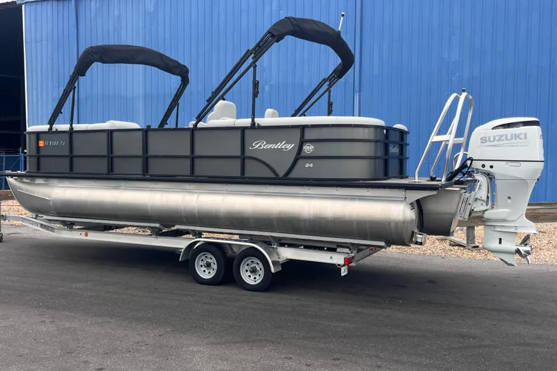 Slide: The Image of 2023 Bentley Pontoons 243 Navigator on trailer with Suzuki outboard motor. - 3
