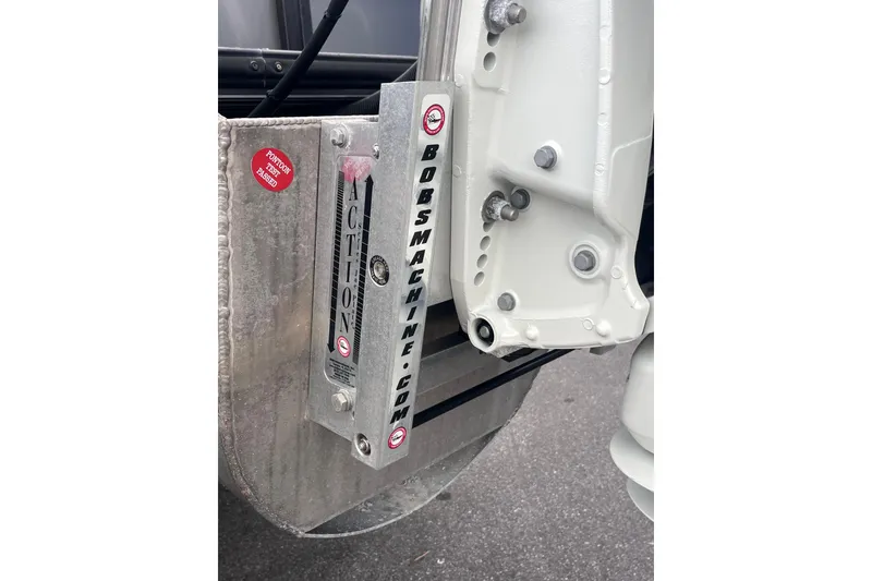 Slide: The Image of Close-up of 2023 Bentley Pontoons 243 Navigator engine mount with inspection sticker. - 6