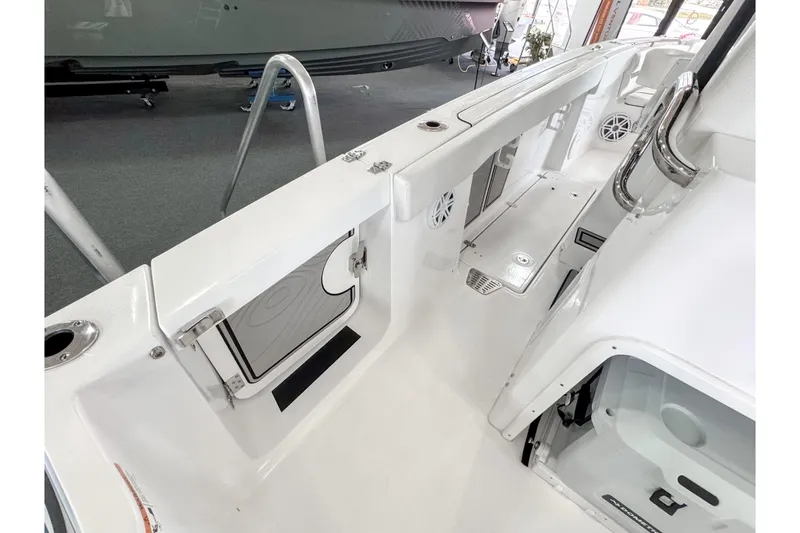 Slide: The Image of 2024 Wellcraft 263 Fisherman boat interior, featuring sleek white design and modern amenities. - 22