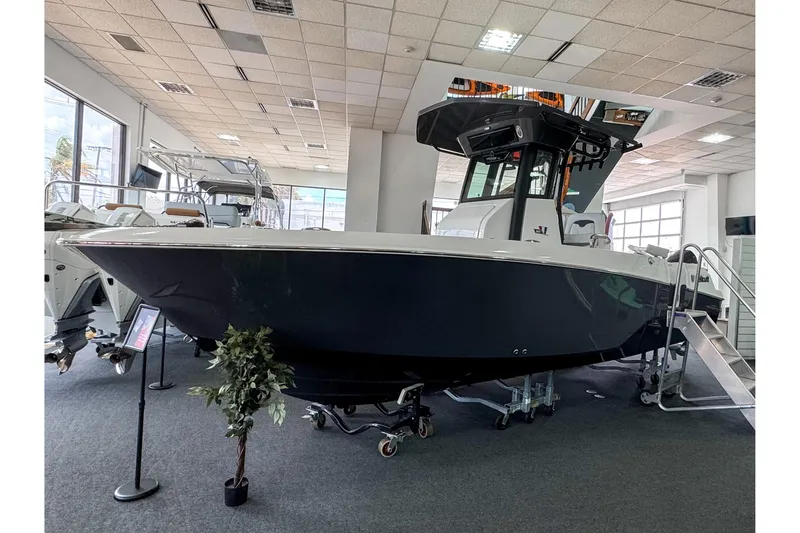 The Image of 2024 Wellcraft 263 Fisherman boat displayed in a showroom, showcasing sleek design and modern features. - 0
