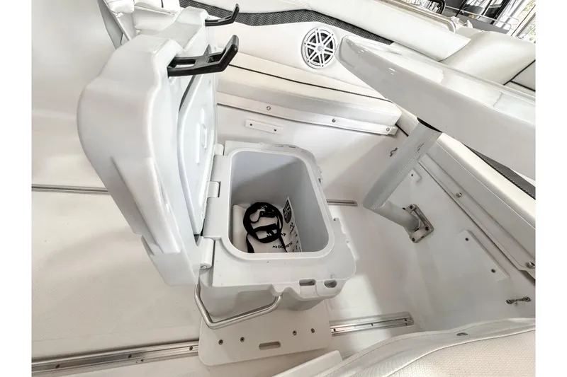 Slide: The Image of 2024 Wellcraft 263 Fisherman boat interior with open storage compartment. - 18