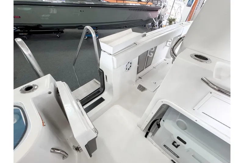 Slide: The Image of 2024 Wellcraft 263 Fisherman boat interior, featuring sleek white design and modern amenities. - 23