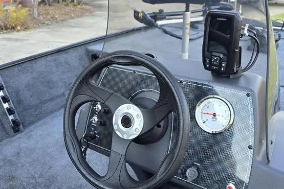 Slide: The Image of Steering console of 2026 Tracker Bass Tracker Classic XL with Garmin device and gauge. - 6