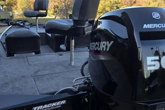 Slide: The Image of 2026 Tracker Bass Tracker Classic XL boat with Mercury engine, featuring spacious seating and deck. - 5