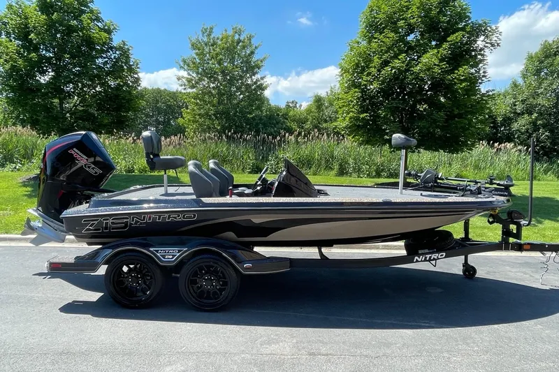 The Image of 2026 Nitro Z19 XL Pro boat on trailer, parked outdoors on a sunny day. - 0