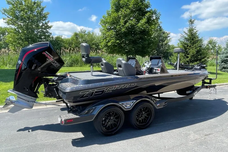 Slide: The Image of 2026 Nitro Z19 XL Pro boat with sleek design, parked outdoors on a sunny day. - 2