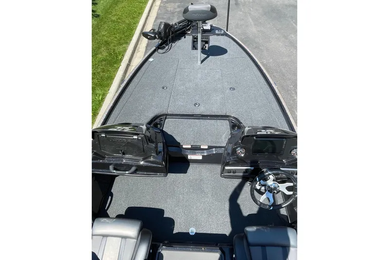 Slide: The Image of The image shows the deck of a 2026 Nitro Z19 XL Pro boat with a helm console and seats. - 4
