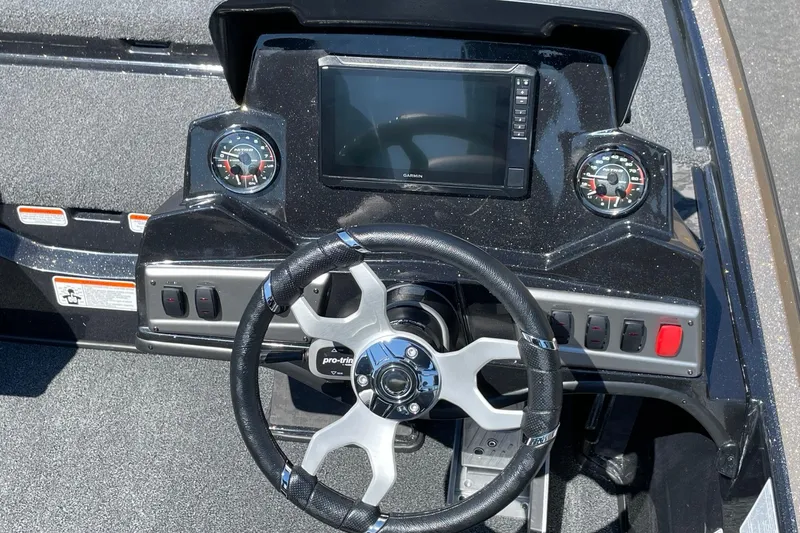 Slide: The Image of Steering console of 2026 Nitro Z19 XL Pro boat with modern controls and display. - 5