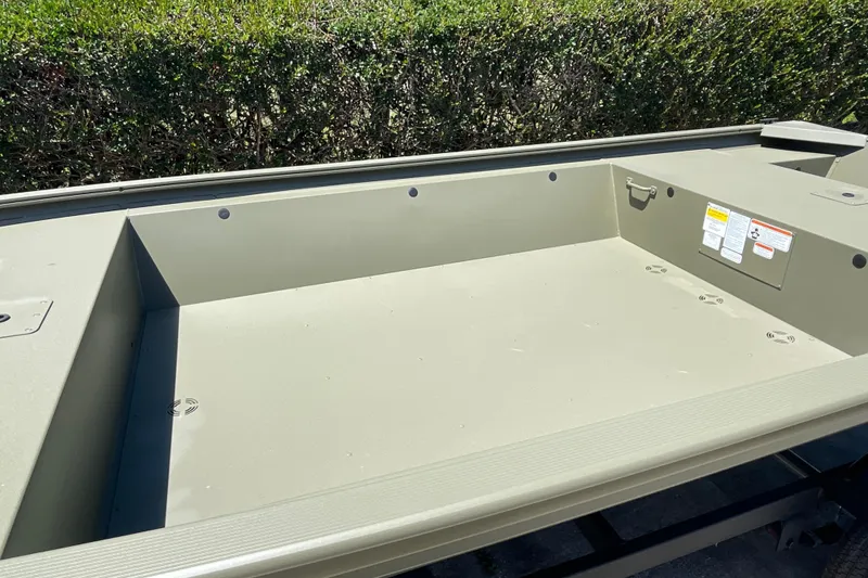 Slide: The Image of 2026 Tracker Grizzly 1648 Utility boat interior, showcasing spacious and durable design. - 11