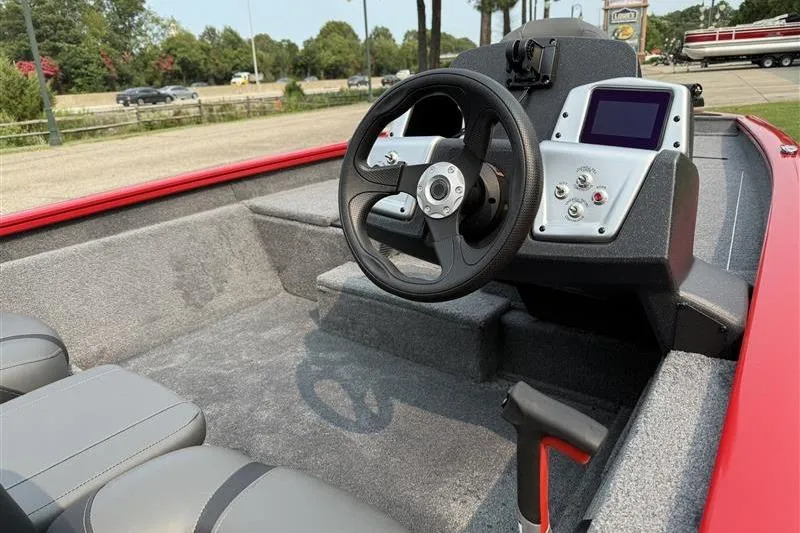 Slide: The Image of 2026 Tracker Pro Team 175 boat interior with steering wheel and control panel. - 7
