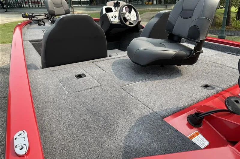 Slide: The Image of 2026 Tracker Pro Team 175 boat interior with gray seating and red accents. - 10