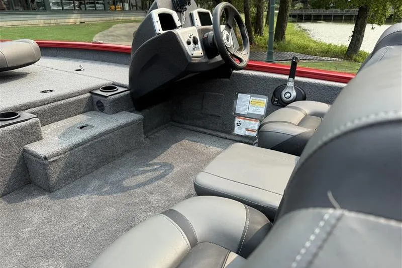 Slide: The Image of 2026 Tracker Pro Team 175 boat interior with steering wheel and seating. - 9