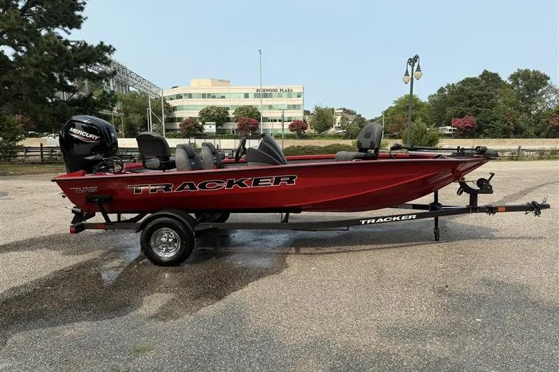 Slide: The Image of 2026 Tracker Pro Team 175 boat in a parking lot, featuring a red hull and Mercury engine. - 4