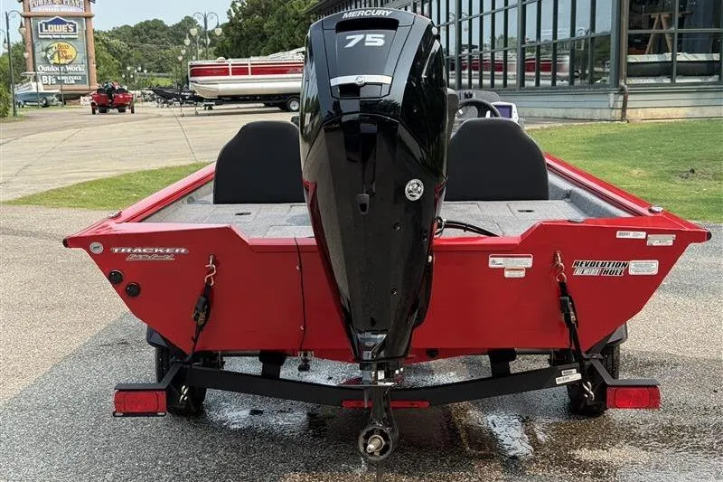 Slide: The Image of 2026 Tracker Pro Team 175 boat with Mercury 75 engine, parked outdoors. - 2