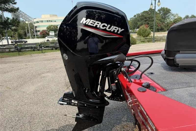 Slide: The Image of 2026 Tracker Pro Team 175 with Mercury outboard motor in a parking lot. - 12
