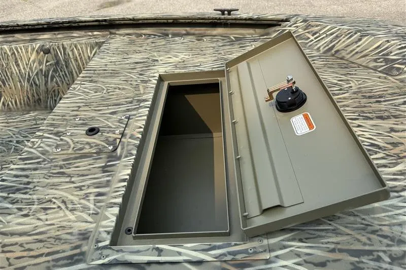 Slide: The Image of 2026 Tracker Grizzly 1648 Utility boat with open storage compartment, camo design. - 8