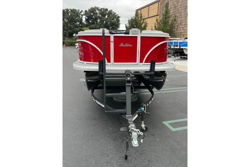 Slide: The Image of 2026 Sun Tracker Party Barge 22 RF DLX pontoon boat on trailer. - 2